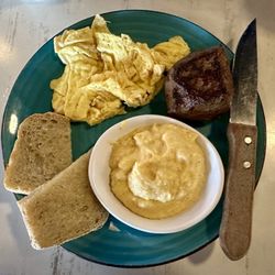 Amelia's - Steak & eggs with cheese grits and toast. July 2024.