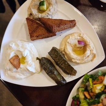 Daddy's Place - Part of the mezza appetizer! 3 dips, grapeleaves, and I think cornbread? Sooo good - Mediterranean Near Me - Easton, Pennsylvania