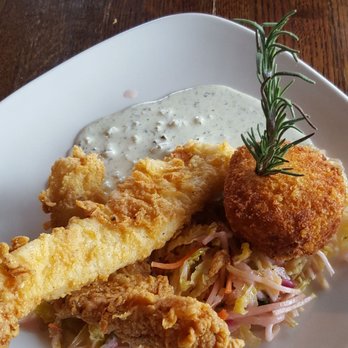 North Harbor Club - Fried Catfish with fried mashed potatoes and pickled cabbage. - New American Near Me - Davidson, North Carolina North Harbor Club - Fried Catfish with fried mashed potatoes and pickled cabbage. - New American Near Me - Davidson, North Carolina