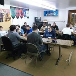 The Arena - People playing trading card games in the back