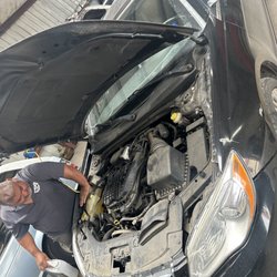 Mendoza Auto Shop - Fixing the radiator leak.