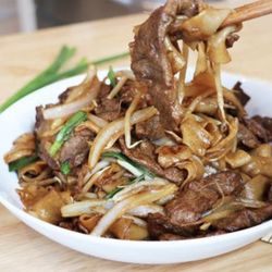 Oriental Express Restaurant - Indulge in our Beef Chow Fun--tender beef stir-fried with wide noodles and crisp veggies in a savory sauce. A comforting classic!