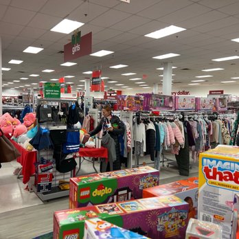 T J Maxx - Children's clothing racks and toy displays are visible in a retail store, with shoppers browsing and shopping. - Department Stores Near Me - Lyndhurst, New Jersey