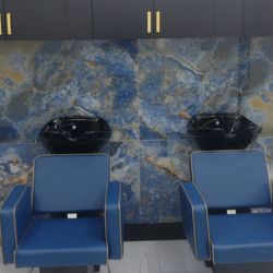Opy’s Unisex Salon - Clean and comfortable shampoo area  with seats that recline.