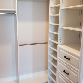 Artisan Closets and Trim Inc. - Walk in closet organizer with shoe shelves, clothes hanging area and drawers. - General Contractors Near Me - Dunedin, Florida Artisan Closets and Trim Inc. - Walk in closet organizer with shoe shelves, clothes hanging area and drawers. - General Contractors Near Me - Dunedin, Florida