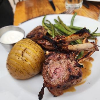 Ragged Point Restaurant - Lamb chops with hassleback potatoe and green beans - American Near Me - Ragged Point, California Ragged Point Restaurant - Lamb chops with hassleback potatoe and green beans - American Near Me - Ragged Point, California