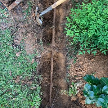 C Squared Designs - a man digging a hole in the ground - Door Sales/Installation Near Me C Squared Designs - a man digging a hole in the ground - Door Sales/Installation Near Me