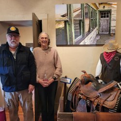 Steam Pump Ranch - The granddaughter of one of the Proctors posing with her saddle