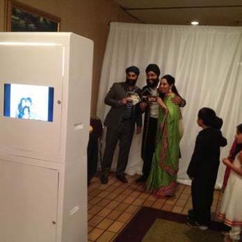 ReBooth Photobooth - Live slideshow screen at back of  our photobooth for your guest to see all the pictures that was being taken in real time - Event Photography Near Me - Calgary, Alberta