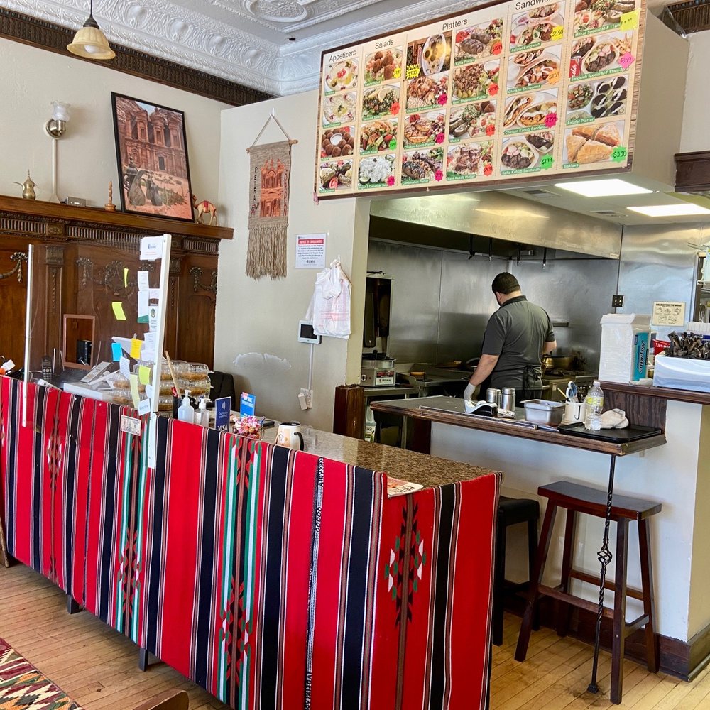 Petra Falafel - a man preparing food in a restaurant - Falafel Near Me - Forest Park, Illinois Petra Falafel - a man preparing food in a restaurant - Falafel Near Me - Forest Park, Illinois