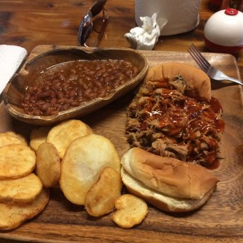 The Outpost - BBQ plate served on wood... the ambience is rustic, just fantastic! - American Near Me - Savannah, Tennessee