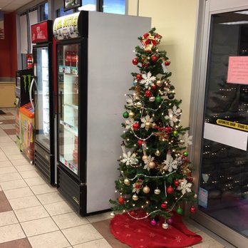 ampm - a christmas tree in front of a refrigerator - Convenience Stores Near Me - Chandler, Arizona