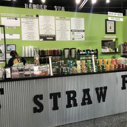 a woman standing at a counter a woman standing at a counter