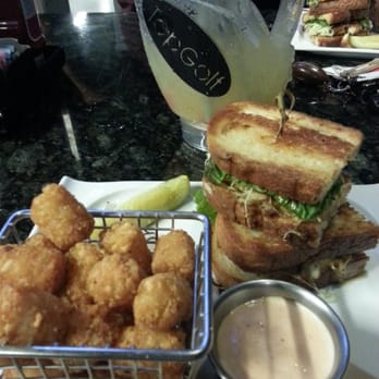 Topgolf - Shareable golf bag fish bowl drink. Crab cake sandwich with a side of tater tots. - New American Near Me - Tampa, Florida Topgolf - Shareable golf bag fish bowl drink. Crab cake sandwich with a side of tater tots. - New American Near Me - Tampa, Florida