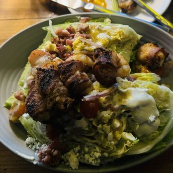 Timber Wood Fire Bistro - Wedge and Shrimp. Wedge salad with spicy bacon-wrapped shrimp on top. One of the BEST wedge salads I've ever eaten. EVER. - Pizza Near Me - Omaha, Nebraska Timber Wood Fire Bistro - Wedge and Shrimp. Wedge salad with spicy bacon-wrapped shrimp on top. One of the BEST wedge salads I've ever eaten. EVER. - Pizza Near Me - Omaha, Nebraska