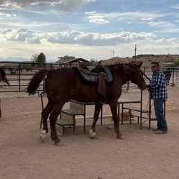 Saddling up to enjoy a leisurely horseback ride through Nevada's desert wilderness Saddling up to enjoy a leisurely horseback ride through Nevada's desert wilderness