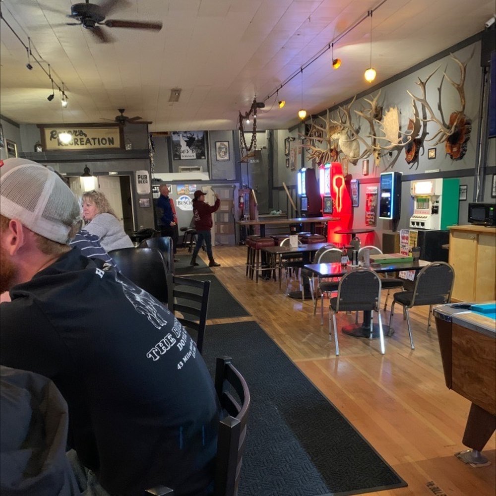 Joe's Bar - a man sitting at a pool table - Bars Near Me - Saint Maries, Idaho