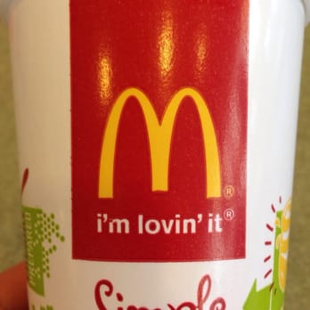 McDonald's - a person holding a cup of food - Fast Food Near Me - Manteno, Illinois