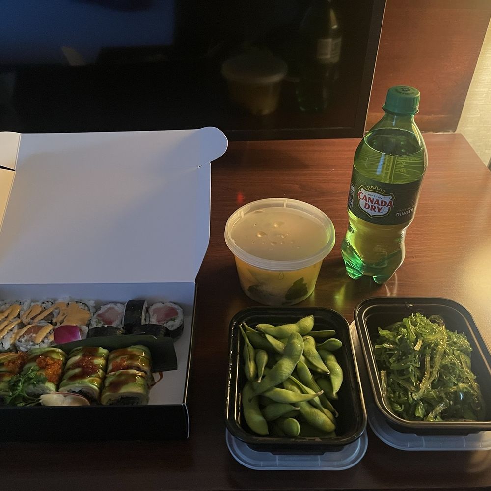 Miso soup, seaweed salad, edamame, ginger soda, spicy salmon roll, spicy yellowtail roll, unagi avocado roll, and spider maki. Miso soup, seaweed salad, edamame, ginger soda, spicy salmon roll, spicy yellowtail roll, unagi avocado roll, and spider maki.
