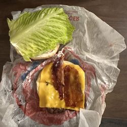 Wendy's - Jr. Bacon Cheeseburger with a goat rib of lettuce larger than the burger and too tough to bite through