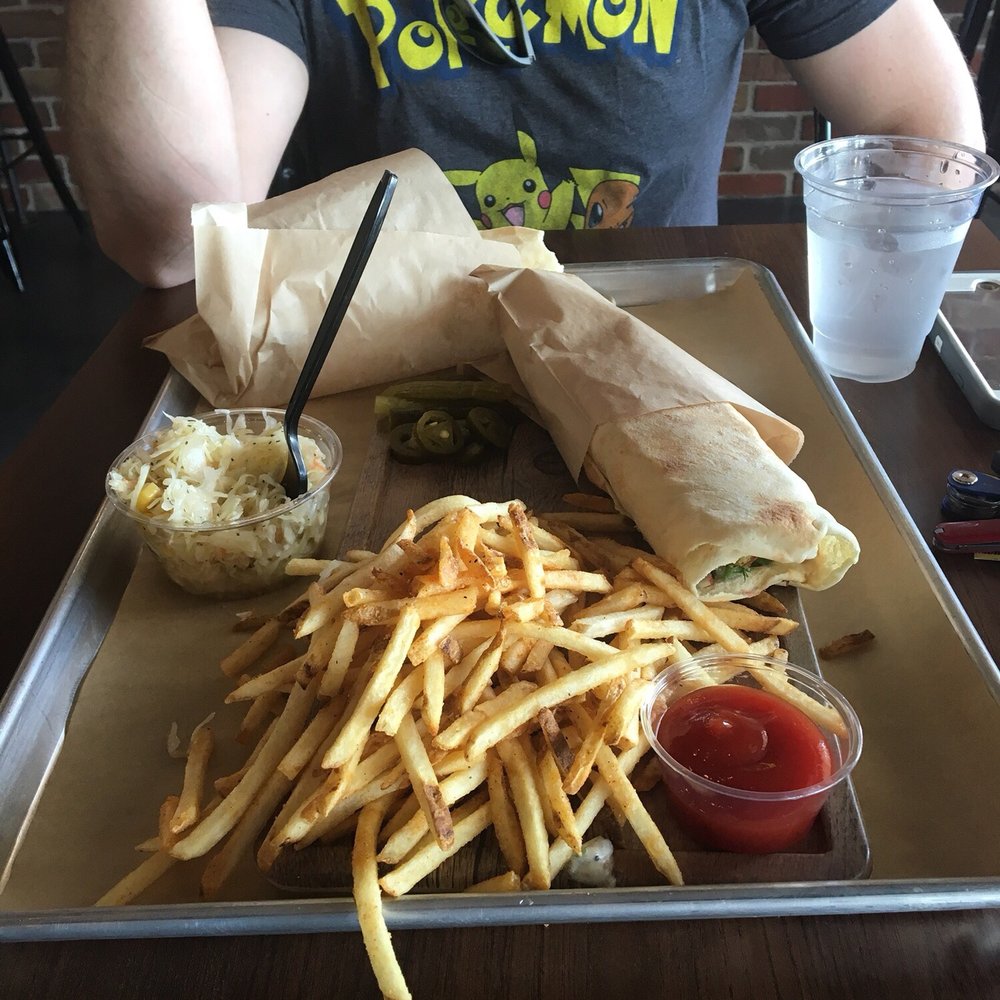Board Bites - Falafel sandwich on a board and a chicken sandwich a la carte. French fries were INCREDIBLE! Cabbage salad is very tasty! - Lebanese Near Me - Plano, Texas