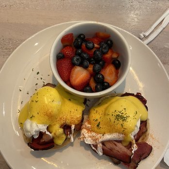 Toast Kitchen & Bar - Classic Benedict with Berries on the side. - Breakfast & Brunch Near Me - Brea, California Toast Kitchen & Bar - Classic Benedict with Berries on the side. - Breakfast & Brunch Near Me - Brea, California