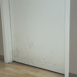 Dirty doors - I'm waiting in a hall for my ultrasound in my medical gown