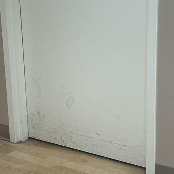 SimonMed Imaging - Daly City - Dirty doors - I'm waiting in a hall for my ultrasound in my medical gown - Diagnostic Imaging Near Me - Daly City, California
