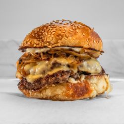 Cubby's - Cub's Pub. Two 4 oz. black angus beef patties with caramelized onions, swiss cheese, black pepper aioli, and tangy burger sauce.