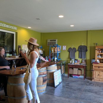 Domanico Cellars Winery and Tasting Room - a woman standing at the bar - Wineries Near Me - Prosser, Washington Domanico Cellars Winery and Tasting Room - a woman standing at the bar - Wineries Near Me - Prosser, Washington