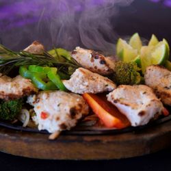 Nanglo Indian and Nepalese restaurant - Boneless piceses of tandoor grilled chicken breast. Marinated spice and cream. #Malai Chicken Tikka