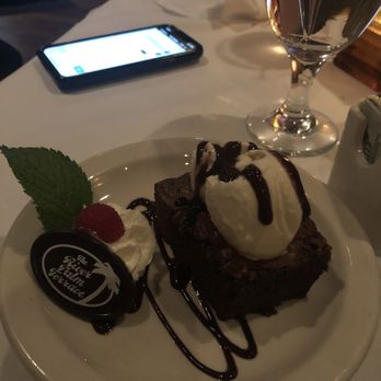 The River Palm Terrace - Chocolate brownie with vanilla ice cream and fudge. The nice waiter split it into smaller orders for kids to share. - Steakhouses Near Me - Edgewater, New Jersey The River Palm Terrace - Chocolate brownie with vanilla ice cream and fudge. The nice waiter split it into smaller orders for kids to share. - Steakhouses Near Me - Edgewater, New Jersey