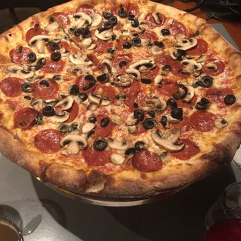 Home Slice Pizza - Pizza with olives, pepperoni, mushroom - Pizza Near Me - Austin, Texas