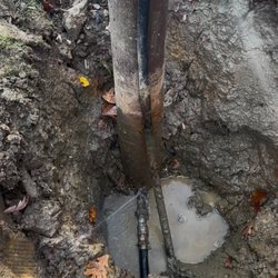 Stover's Wells & Pumps - a leak at a well head connector in a trench