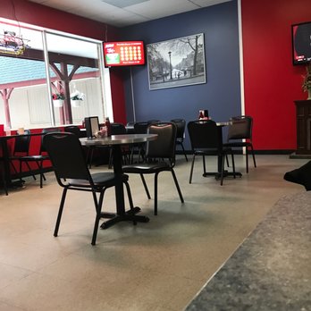 Wings Station - the inside of a restaurant with tables and chairs - Chicken Wings Near Me - Swanton, Ohio