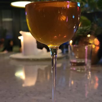 Miaou Miaou - a glass of wine on a table - Lounges Near Me - Minneapolis, Minnesota Miaou Miaou - a glass of wine on a table - Lounges Near Me - Minneapolis, Minnesota