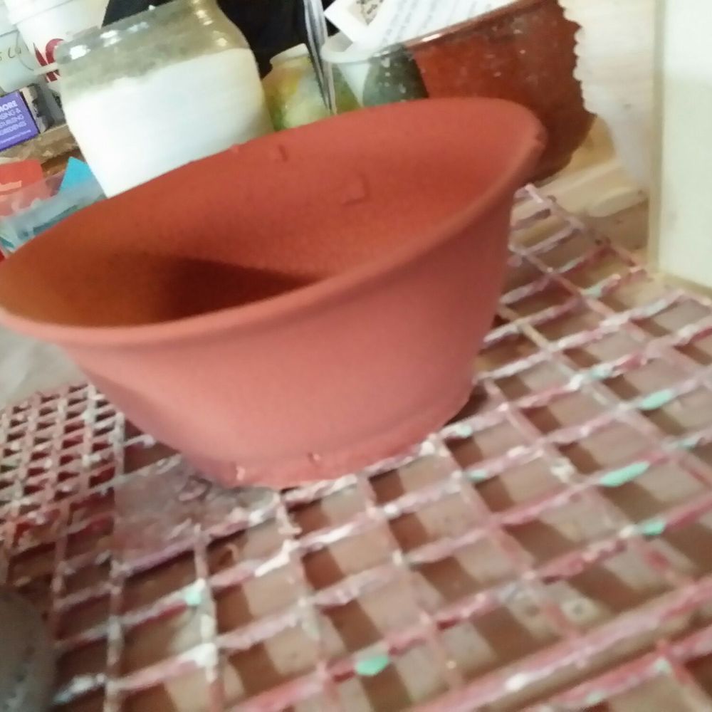Some else's bisque ware with copper red glazing by me.