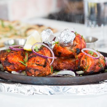 Tandoori Tonight - a platter of food on a table - Indian Near Me - Barrie, Ontario Tandoori Tonight - a platter of food on a table - Indian Near Me - Barrie, Ontario