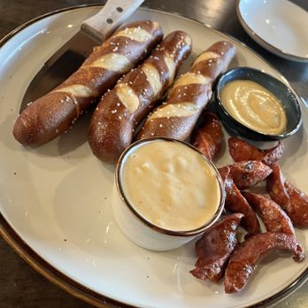 Finley's Round Rock - Pretzels and sausage with queso and Dijon mustard - Bars Near Me - Round Rock, Texas