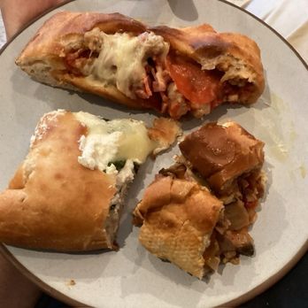 Mikie's Pizza & Subs - Samples of savory juicy stuffed sausage pepperoni mozz and spinach mozz calzones, & flavorful tender "Italian" mozzarella cheesesteak - Pizza Near Me - Baltimore, Maryland