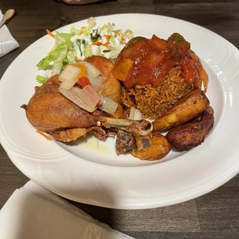 Steaming Pots - Jollof rice and fried chicken. - African Near Me - Tampa, Florida Steaming Pots - Jollof rice and fried chicken. - African Near Me - Tampa, Florida