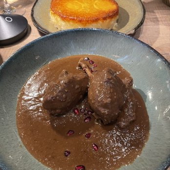 Rumis Kitchen - Duck Fesenjoon with a crispy potato tahdeeg - Persian/Iranian Near Me - Houston, Texas