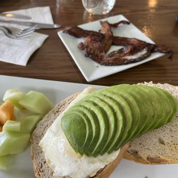 The Friendly Fox - Avocado toast with egg and bacon...I subbed out the English muffin for their house made bagel. Delish. - Cafes Near Me - Fort Wayne, Indiana The Friendly Fox - Avocado toast with egg and bacon...I subbed out the English muffin for their house made bagel. Delish. - Cafes Near Me - Fort Wayne, Indiana