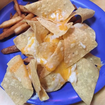 Mexico Joe's - These are the Smothered Nachos from the kids menu.  Should be called "Mom nuked these using the last of the cheese." - Mexican Near Me - Stillwater, Oklahoma