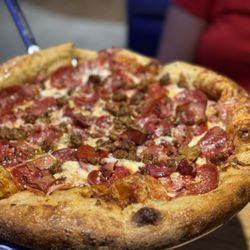 Mellow Mushroom - Riverview - Mighty Meaty:  Mellow red sauce, pepperoni, Italian sausage, honey ham, applewood-smoked bacon, mozzarella.