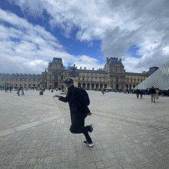 Pyramide du Louvre - Me running not really though. Illusion - Landmarks & Historical Buildings Near Me - Paris, 75