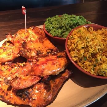 Nando's Peri-Peri - The whole chicken platter with macho peas and Portuguese rice. - Chicken Shop Near Me - Chicago, Illinois