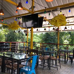 El Bochinche - Outside seating on the terrace. There are plenty of fans to keep the air moving so it doesn't feel hot.