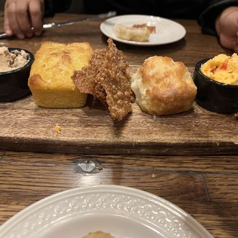 The Pinery - Incredible bread platter, cornbread, fry bread and a biscuit, served with a honey butter and pimento cheese on the side - American Near Me - Orlando, Florida The Pinery - Incredible bread platter, cornbread, fry bread and a biscuit, served with a honey butter and pimento cheese on the side - American Near Me - Orlando, Florida