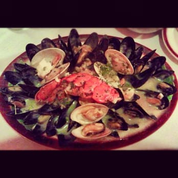 Cafe Riazor - Mariscada En Salsa Verde seafood platter of mussels, clams, shrimp, and lobster piece in a thick parsley sauce - Spanish Near Me - New York, New York